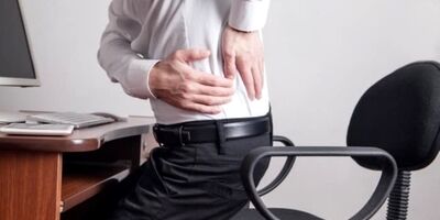 علت کمردرد هنگام نشستن چیست؟ + ورزش و درمان 